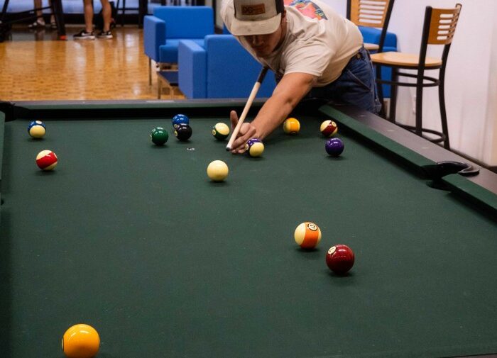 students playing billiards