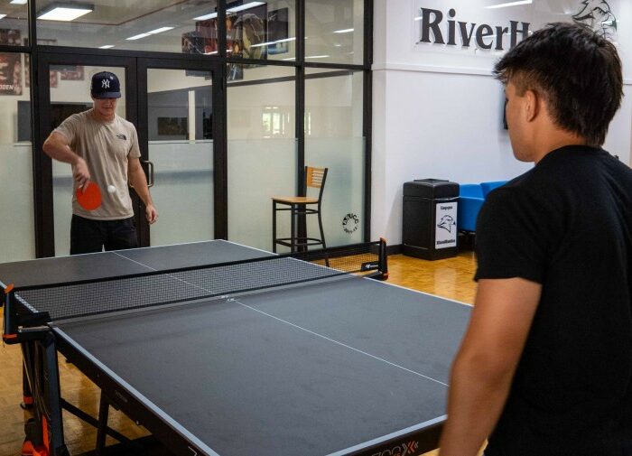 students playing ping pong
