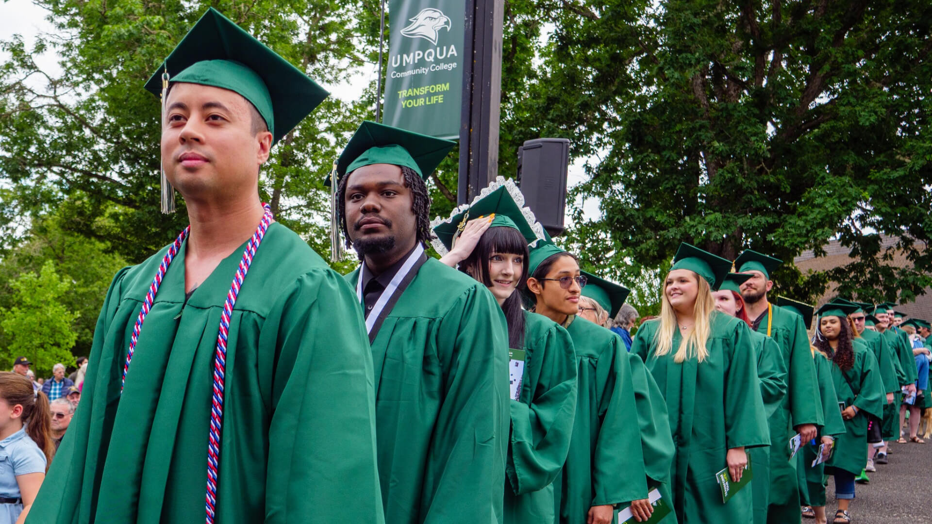 students walking at graduation