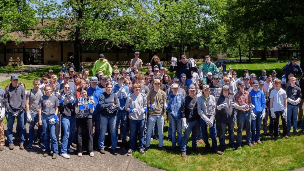 Group photo of Douglas County students wearing welding gloves