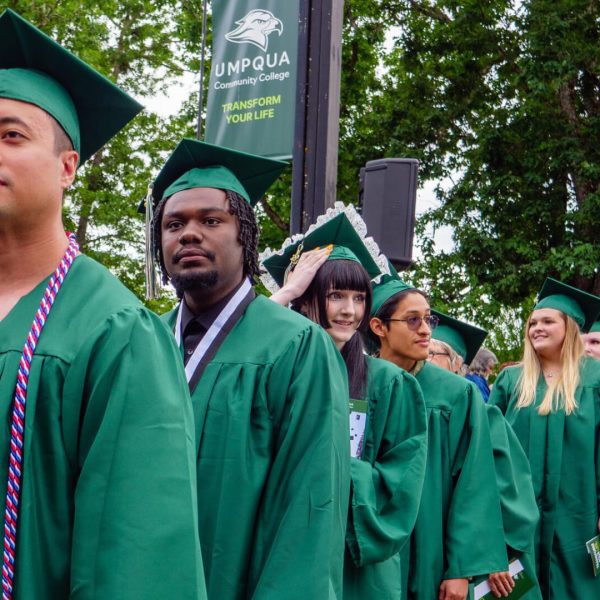 students walking at graduation